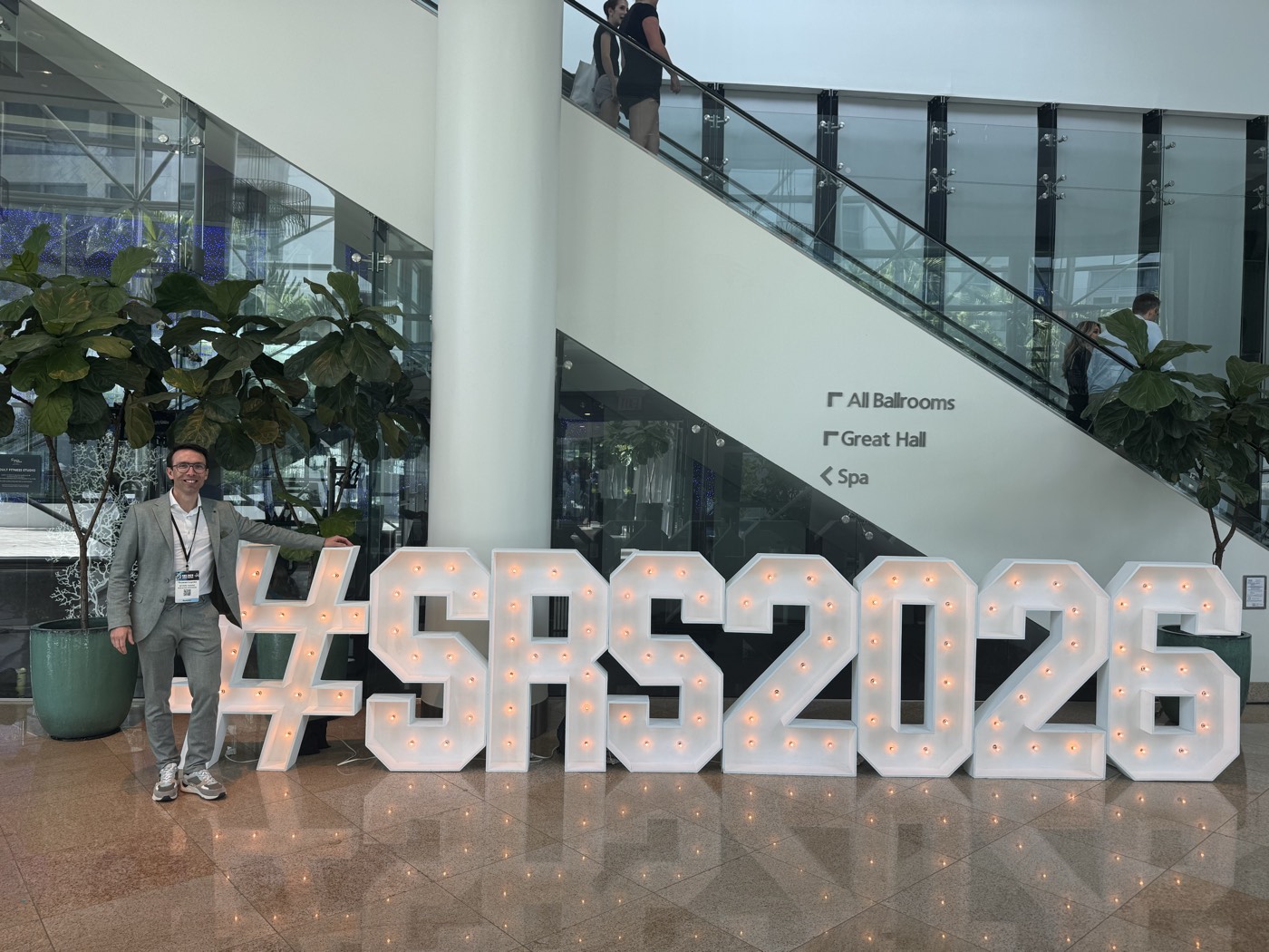 Thomas Luyckx beside the #SRS2026 sign in the conference venue in Hollywood, Florida
